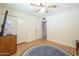 Bedroom with double closet, ceiling fan and wood floors at 2911 W Lamar Rd, Phoenix, AZ 85017