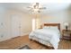 Light and airy bedroom with ceiling fan and wood floors at 2911 W Lamar Rd, Phoenix, AZ 85017