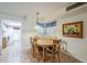 Bright dining area adjacent to kitchen with wood table and chairs at 2911 W Lamar Rd, Phoenix, AZ 85017