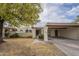 Single-level home with carport and landscaped front yard at 2911 W Lamar Rd, Phoenix, AZ 85017