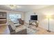 Living room with recliner chairs, TV, and tile floors at 2911 W Lamar Rd, Phoenix, AZ 85017