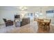 Living room with dining area and kitchen view at 2911 W Lamar Rd, Phoenix, AZ 85017