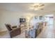 Living room with recliner chairs, TV, and tile floors at 2911 W Lamar Rd, Phoenix, AZ 85017