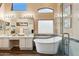 Luxurious bathroom with a soaking tub and double vanity at 3165 E Indigo Bay Dr, Gilbert, AZ 85234