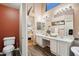 Double vanity bathroom with a toilet and view of bedroom at 3165 E Indigo Bay Dr, Gilbert, AZ 85234