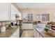 Kitchen with granite countertops, stainless steel appliances, and white cabinets at 3165 E Indigo Bay Dr, Gilbert, AZ 85234