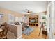 Gathering room with hardwood floors, built-in shelving, and a cozy seating area at 3165 E Indigo Bay Dr, Gilbert, AZ 85234