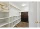 Large walk-in closet with ample shelving and drawers at 3165 E Indigo Bay Dr, Gilbert, AZ 85234