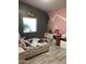 bedroom with pink and gray color scheme at 3216 W Melody Dr, Laveen, AZ 85339