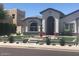 Stunning curb appeal, featuring a fountain and manicured lawn at 3216 W Melody Dr, Laveen, AZ 85339