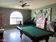 Game room with a pool table and large arched window at 3216 W Melody Dr, Laveen, AZ 85339