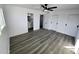 Bright bedroom with ceiling fan and sliding door closet at 3447 W Dailey St, Phoenix, AZ 85053