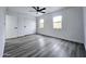 Bright bedroom with ceiling fan and two windows at 3447 W Dailey St, Phoenix, AZ 85053