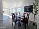 Bright dining area features a wooden table, artwork, and lots of natural light through the arched windows at 3447 W Dailey St, Phoenix, AZ 85053