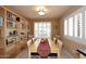 Dining room with built-in shelving and window shutters at 4015 N 78Th St # 141, Scottsdale, AZ 85251