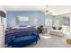 Main bedroom with sitting area and mirrored closet doors at 4043 W Saguaro Park Ln, Glendale, AZ 85310