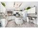 Large kitchen with granite countertops, white cabinets and island at 4043 W Saguaro Park Ln, Glendale, AZ 85310