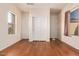 Bright bedroom with hardwood floors and double door closet at 42899 W Whimsical Dr, Maricopa, AZ 85138