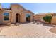 Brick paved courtyard with lounge chairs and a view of the front door at 42899 W Whimsical Dr, Maricopa, AZ 85138