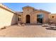 Brick paved courtyard with lounge chairs and a view of the front door at 42899 W Whimsical Dr, Maricopa, AZ 85138