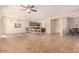 Open living room and kitchen with tile floors at 42899 W Whimsical Dr, Maricopa, AZ 85138