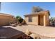 Private backyard patio with brick pavers and lounge chairs at 42899 W Whimsical Dr, Maricopa, AZ 85138