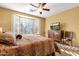 Bright bedroom with large window, wood flooring, and dresser at 4531 E Jude Ln, Gilbert, AZ 85298