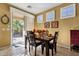 Bright dining area with wood table and access to backyard patio at 4531 E Jude Ln, Gilbert, AZ 85298