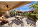 Covered patio with seating area and fire pit at 4531 E Jude Ln, Gilbert, AZ 85298