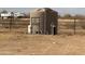 Large water tank and well pump system on property at 48548 W Long Rifle Rd, Aguila, AZ 85320