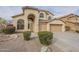 Two-story house with beige exterior, landscaped yard, and two-car garage at 532 N Bell Dr, Chandler, AZ 85225