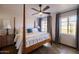 Main bedroom with a wooden bed frame and ceiling fan at 533 W Lewis Ave, Phoenix, AZ 85003