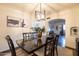 Formal dining area with six chairs and a view into the living room at 533 W Lewis Ave, Phoenix, AZ 85003