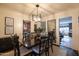 Elegant dining room with a dark wood table and modern lighting fixture at 533 W Lewis Ave, Phoenix, AZ 85003