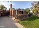 Front view of the house with driveway and carport at 533 W Lewis Ave, Phoenix, AZ 85003