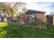 Side view of the house showcasing landscaping and yard at 533 W Lewis Ave, Phoenix, AZ 85003