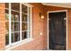 Dark-stained front door with glass window insets at 533 W Lewis Ave, Phoenix, AZ 85003