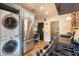 Stackable washer and dryer tucked away in a kitchen alcove at 533 W Lewis Ave, Phoenix, AZ 85003