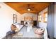 Cozy living room with wood ceiling, mid-century modern furniture, and large windows at 533 W Lewis Ave, Phoenix, AZ 85003