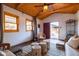 Bright living room with wood ceiling, mid-century modern furniture, and access to backyard at 533 W Lewis Ave, Phoenix, AZ 85003