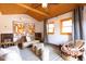 Cozy living room with wood ceiling, mid-century modern furniture, and large windows at 533 W Lewis Ave, Phoenix, AZ 85003