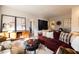 Living room with sectional sofa, coffee table, and mid-century accents at 533 W Lewis Ave, Phoenix, AZ 85003