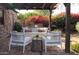 Outdoor patio furniture under a shaded pergola in a backyard setting at 533 W Lewis Ave, Phoenix, AZ 85003