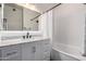 Modern bathroom with a white vanity and a bathtub at 5350 E Deer Valley Dr # 2403, Phoenix, AZ 85054