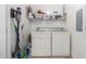 Convenient laundry room with washer, dryer, and shelving at 5350 E Deer Valley Dr # 2403, Phoenix, AZ 85054