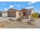 Single-story home with a two-car garage and desert landscaping at 5429 S 23Rd Dr, Phoenix, AZ 85041