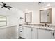 Bathroom with double vanity, granite countertop, and large mirrors at 5711 N 24Th Pl, Phoenix, AZ 85016