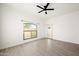 Bright bedroom with tile floors, ceiling fan, and sliding door to patio at 5711 N 24Th Pl, Phoenix, AZ 85016