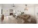 Open concept dining area with wood table and chairs, adjacent to living room at 5711 N 24Th Pl, Phoenix, AZ 85016