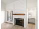 Modern fireplace with shiplap wall and wood mantel at 5711 N 24Th Pl, Phoenix, AZ 85016